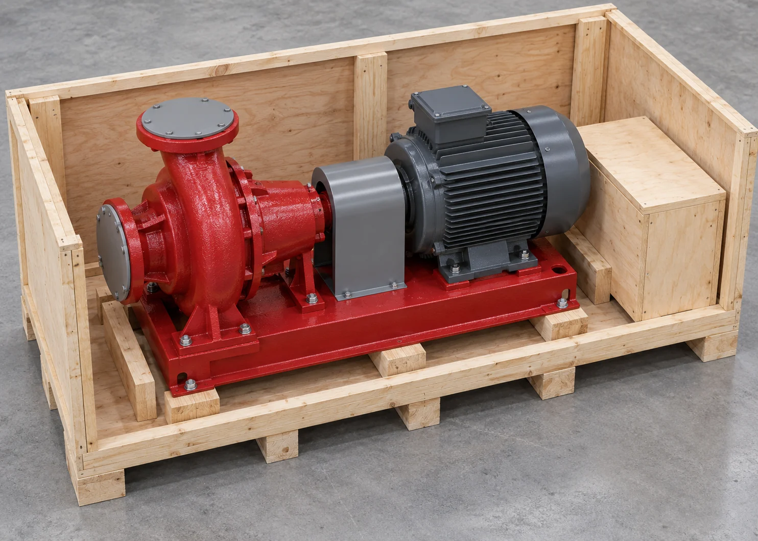 Centrifugal pump and motor supported by their base inside a wooden export crate
